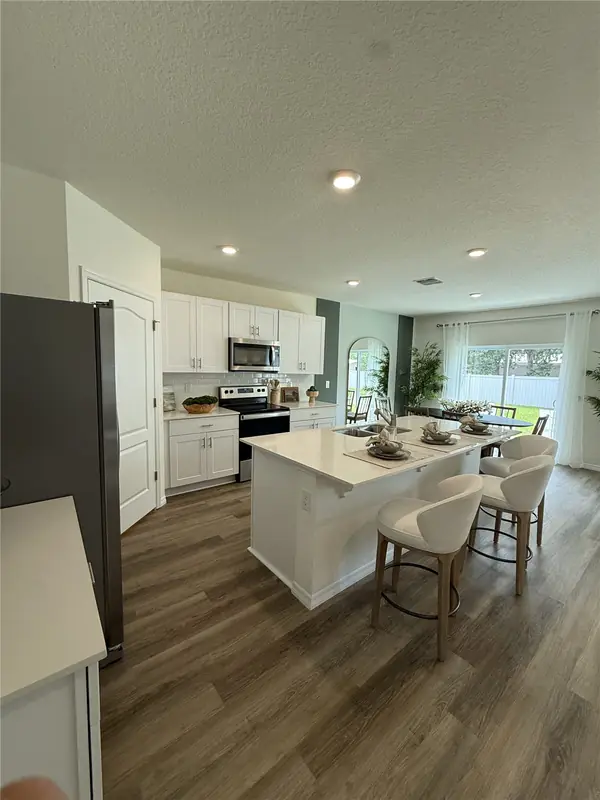 Finished kitchen with an island in a BuilderK custom home